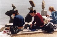 Girls drawing balanced stones