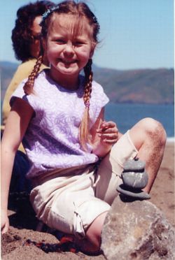 Girl balances and smiles