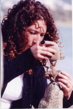 Woman with curls balances