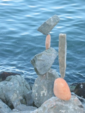 Gray and red balancing rocks