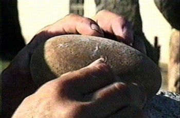 Bill's hands with round rock